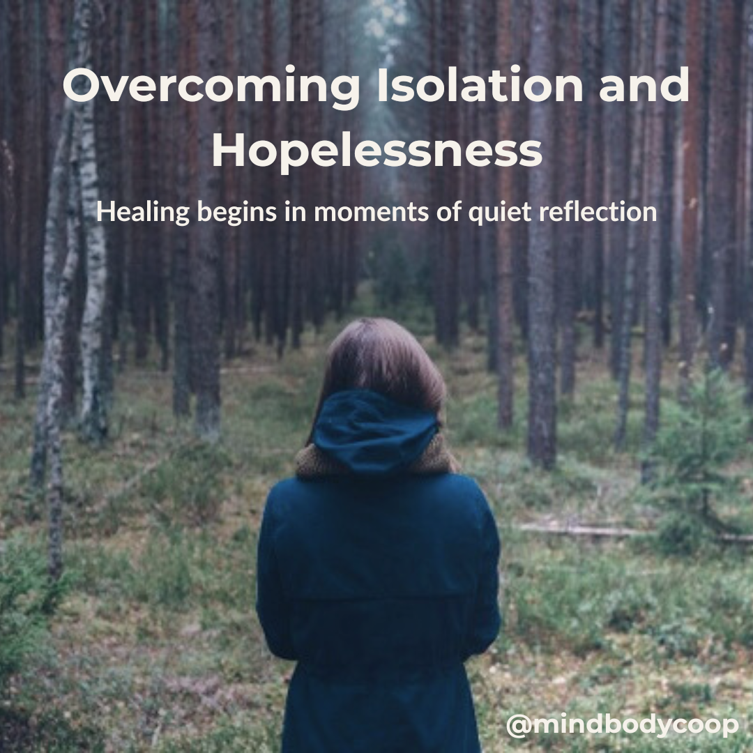 Overcoming Isolation and Hopelessness | Mind Body Co-op Person standing quietly in a forest, symbolizing reflection, healing, and hope in overcoming isolation and hopelessness.
