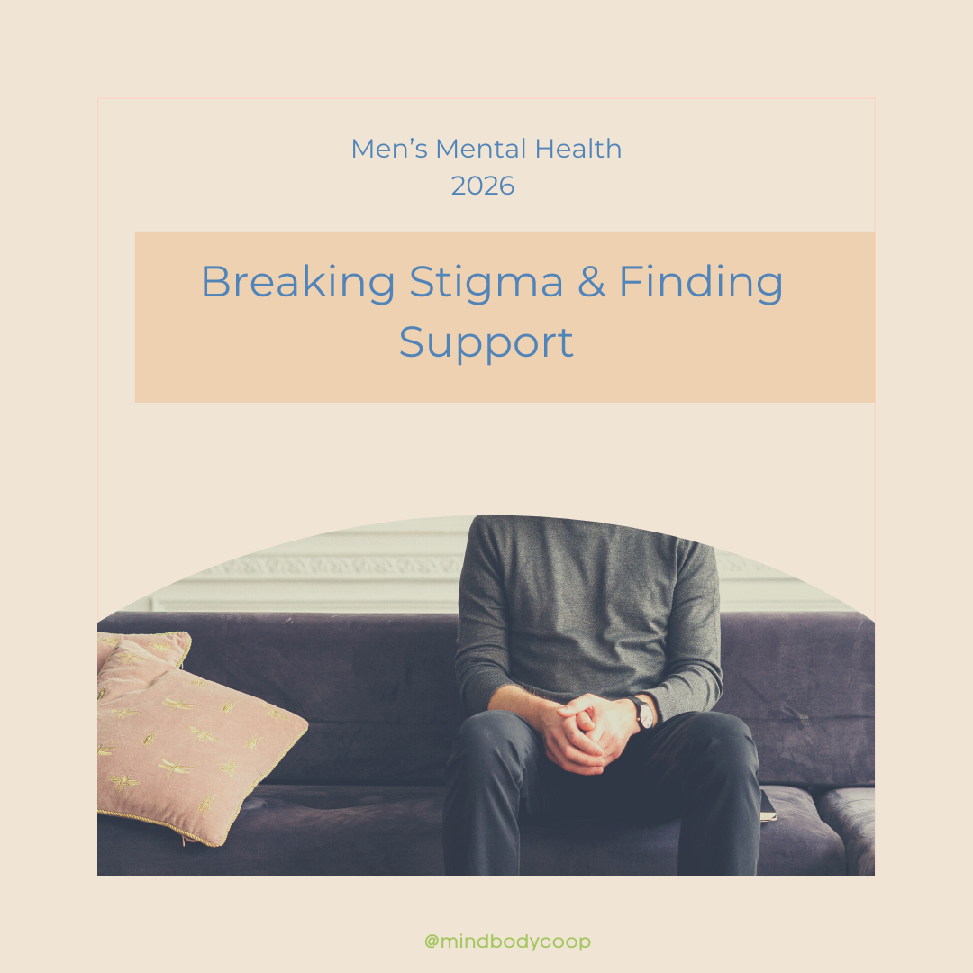 Man seated indoors in a calm, neutral setting, representing reflection and emotional support related to men’s mental health in 2026